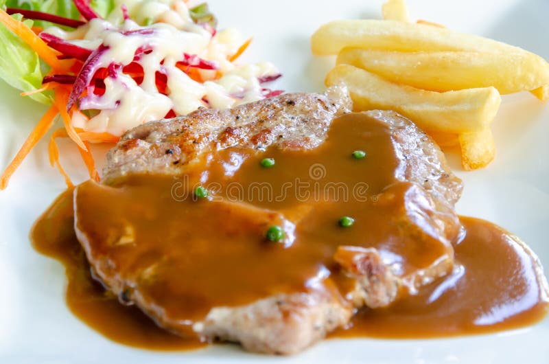 Pork Chop Steak with Brown Gravy Sauce Stock Image Image of cooked