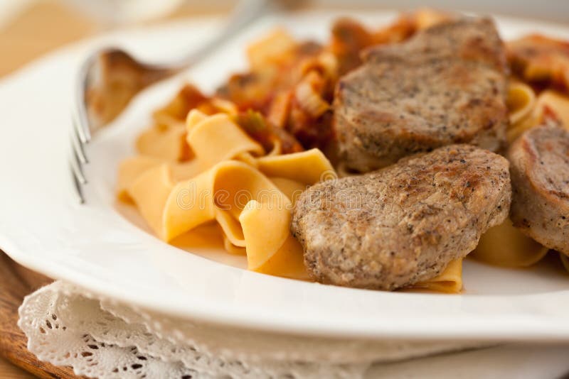 Pork fillet with pasta stock image. Image of sauce, pork 17004585