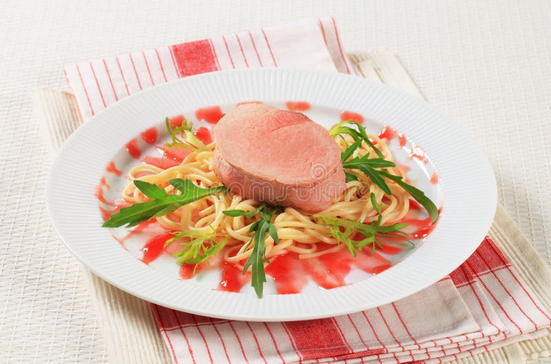 Pork fillet with spaghetti stock photo. Image of reduction 21968374