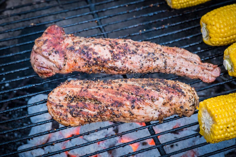 Pork fillets on a barbecue stock photo. Image of coals 90128792