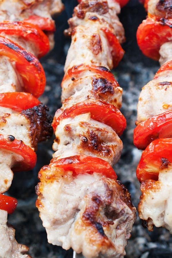 Pork Kebab with Tomatoes on the Grill. Stock Photo Image of fried