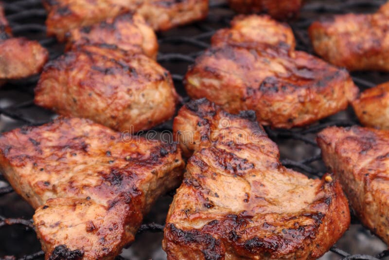 Pork Neck Chops Steaks on the Grill. Soft Focus Stock Photo Image of
