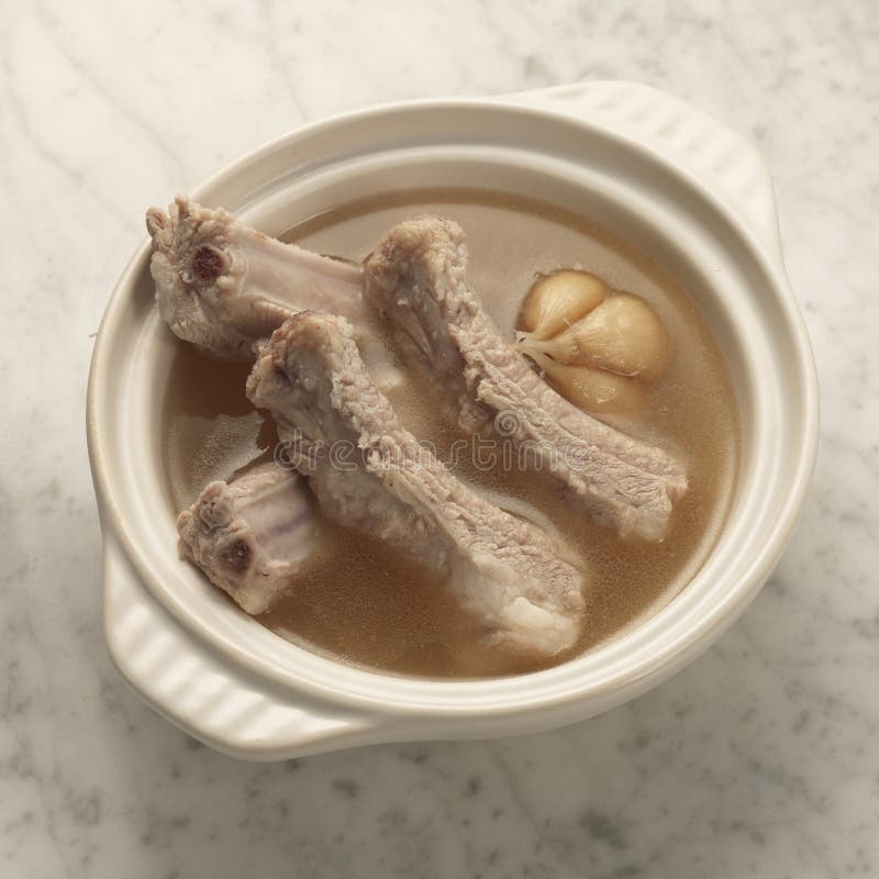 Pork Rib Soup. Traditional slow cooked pork rib with garlic and herbs soup soya sauce side dish in singapore and malaysia for bak kut teh stock images Pork Rib Soup. Traditional slow cooked pork rib with garlic and herbs soup soya sauce side dish in singapore and malaysia for bak kut teh stock images