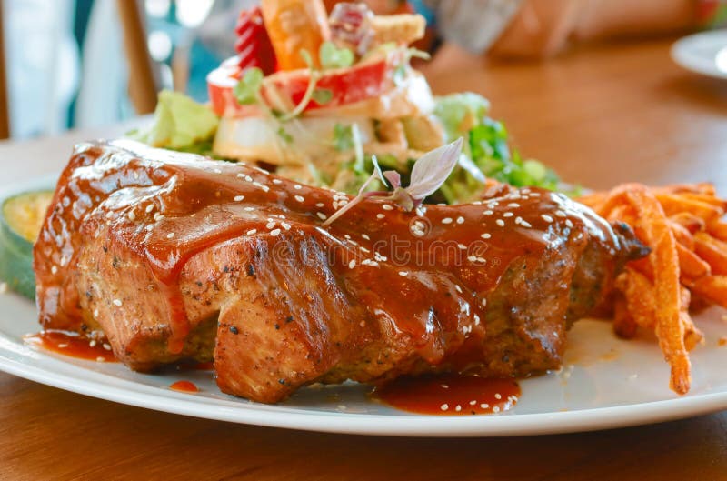 pork ribs grilled with barbecue sauce and sweet potato