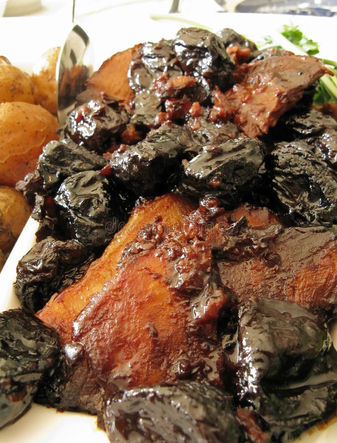 Pork roast with prunes and baby potatoes
