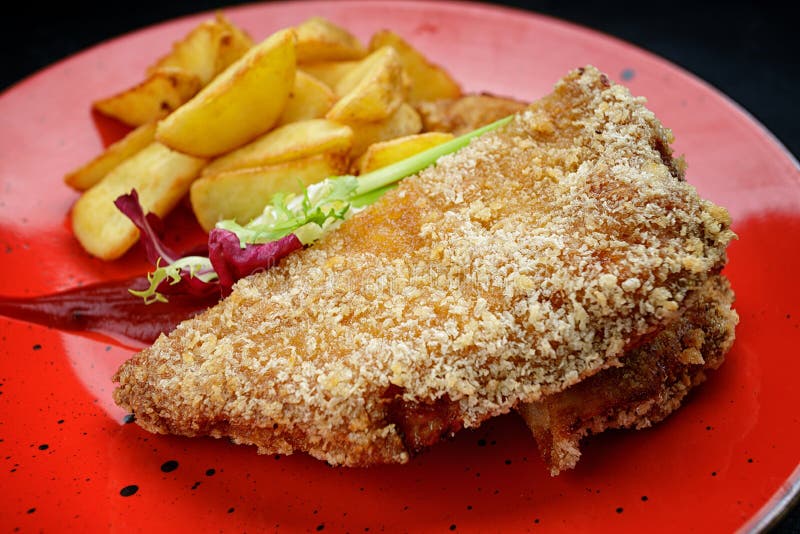 Pork Schnitzel with Potatoes, Sauce and Herbs Stock Image Image of