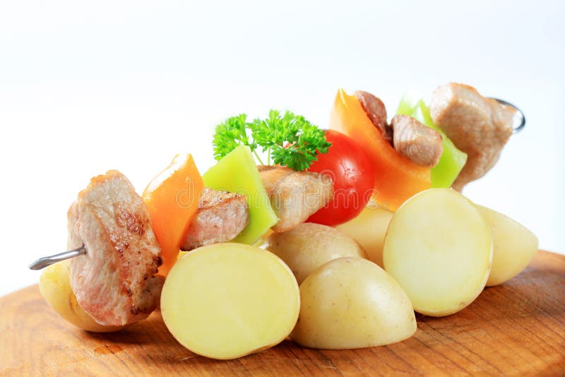 Pork skewer and potatoes