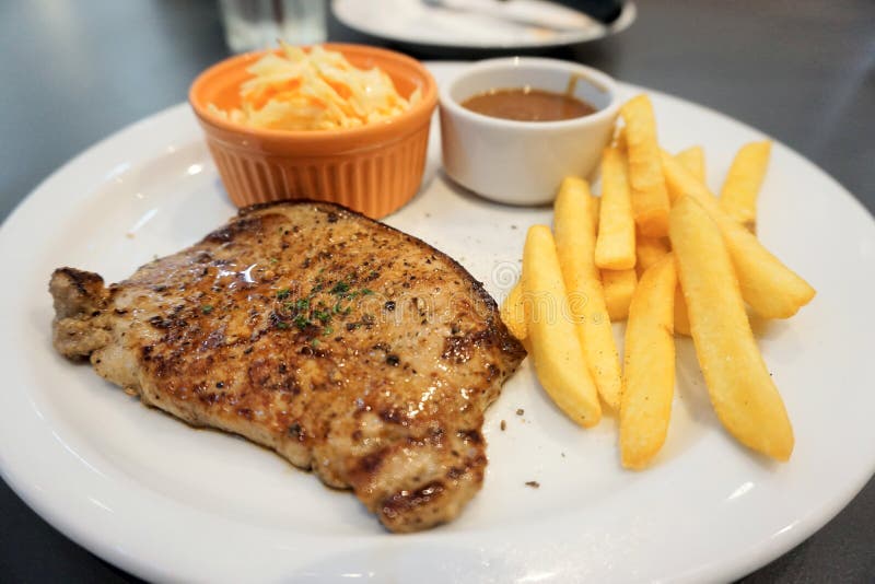 Pork Steak and Potato Fired on Dish Stock Photo - Image of diet