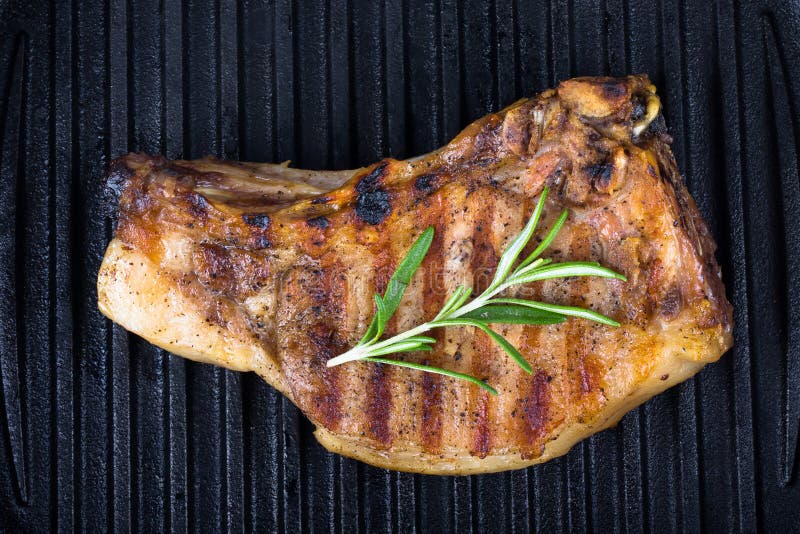Pork Steak with Rosemary on the Grill Pan Stock Image Image of