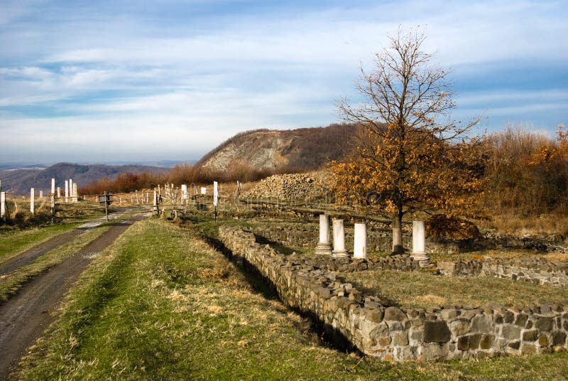 Porolissum was an ancient Roman city in Dacia (Transylvania in Romania of today). Established as a military camp in 106 during Trajan's Dacian Wars, the city became the capital of the province Dacia Porolissensis in 124. Porolissum is on the footh of Meses Mountainse ridge, the ancient natural border of the empire, fortified after the conqest of Dacia. The ruins of Porolissum are located only 8 km far away from Zalau city (the main city of Salaj County in Transylvania region of Romania country). The fort, initially built of wood on stone foundations (after the second war with Dacians, in 106), was garrisoned with 5000 auxiliary troops transferred from Spain, Gaul and Britain. Even though the name Porolissum appears to be Dacian in origin, archaeologists have so far uncovered no evidence of a Dacian settlement preceding the Roman fort. The city quickly grew through trade with the native Dacians. Although the Romans withdrew from Dacia in 271 under Aurelian, the city was abandoned only in 5th century, archaeological evidence shows that it remained inhabited for several centuries afterwards. The site is one of the largest and best-preserved archaeological sites in modern-day Romania. Porolissum was an ancient Roman city in Dacia (Transylvania in Romania of today). Established as a military camp in 106 during Trajan's Dacian Wars, the city became the capital of the province Dacia Porolissensis in 124. Porolissum is on the footh of Meses Mountainse ridge, the ancient natural border of the empire, fortified after the conqest of Dacia. The ruins of Porolissum are located only 8 km far away from Zalau city (the main city of Salaj County in Transylvania region of Romania country). The fort, initially built of wood on stone foundations (after the second war with Dacians, in 106), was garrisoned with 5000 auxiliary troops transferred from Spain, Gaul and Britain. Even though the name Porolissum appears to be Dacian in origin, archaeologists have so far uncovered no evidence of a Dacian settlement preceding the Roman fort. The city quickly grew through trade with the native Dacians. Although the Romans withdrew from Dacia in 271 under Aurelian, the city was abandoned only in 5th century, archaeological evidence shows that it remained inhabited for several centuries afterwards. The site is one of the largest and best-preserved archaeological sites in modern-day Romania.