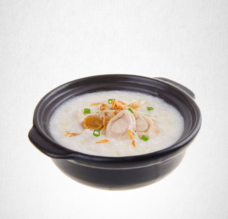 Porridge or abalone porridge in claypot on a background.