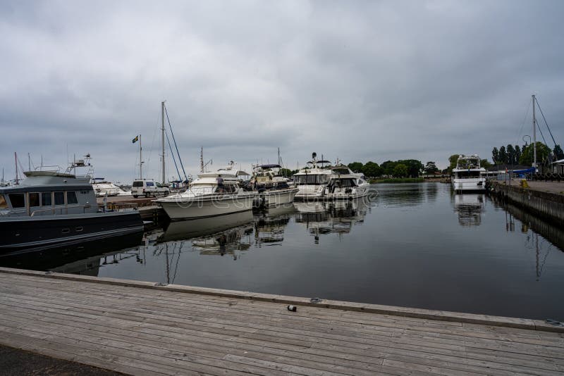 BORGHOLM, SWEDEN - JUNE 24, 2021: Borgholm harbor on Swedish Baltic Sea island Oland. This island is a popular destination for leisure boats. BORGHOLM, SWEDEN - JUNE 24, 2021: Borgholm harbor on Swedish Baltic Sea island Oland. This island is a popular destination for leisure boats