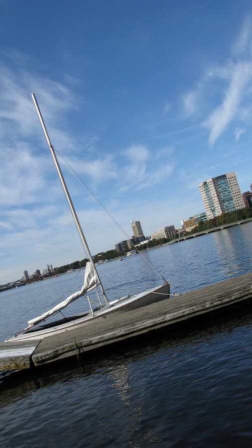 Boston harbor and sailboat moored at a dock. Boston harbor and sailboat moored at a dock.