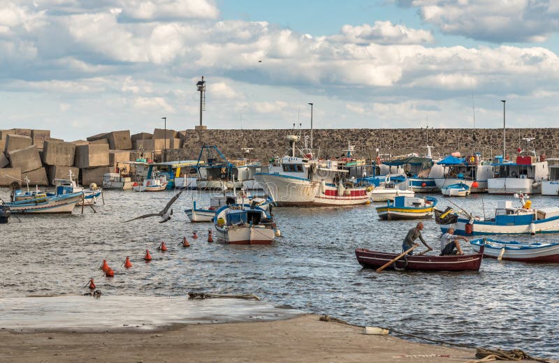 The port of Isola delle Femmine or Island of Women with fishing boats and fishermen at work, province of Palermo, Sicily, Italy. Isola delle Femmine, Palermo royalty free stock images The port of Isola delle Femmine or Island of Women with fishing boats and fishermen at work, province of Palermo, Sicily, Italy. Isola delle Femmine, Palermo royalty free stock images