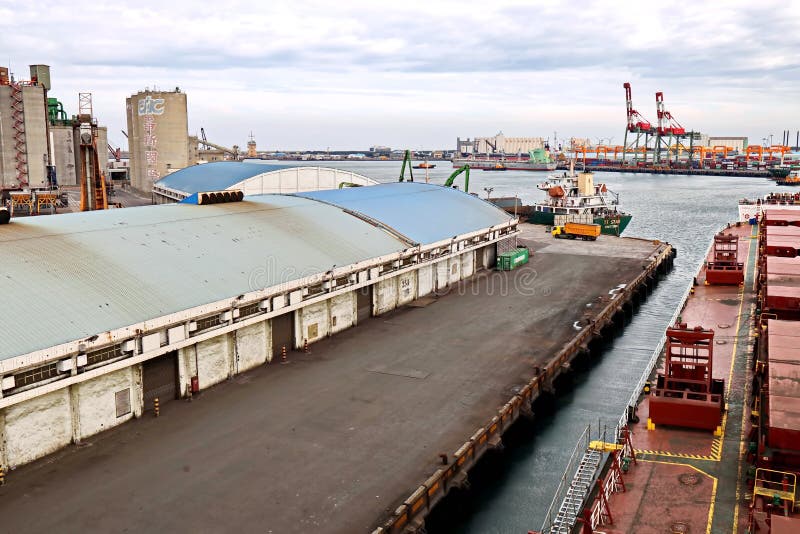 Port of Taichung, Taiwan, September,24,2020.Cargo terminal for unloading bulk cargoes by shore cranes. Views of the pier and vesse