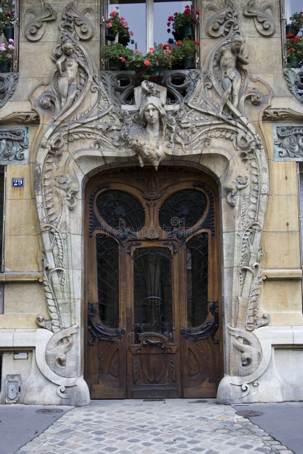 This art nouveau door is very unique and stylish with beautiful statuary above and wrought iron and glass in the door. This art nouveau door is very unique and stylish with beautiful statuary above and wrought iron and glass in the door