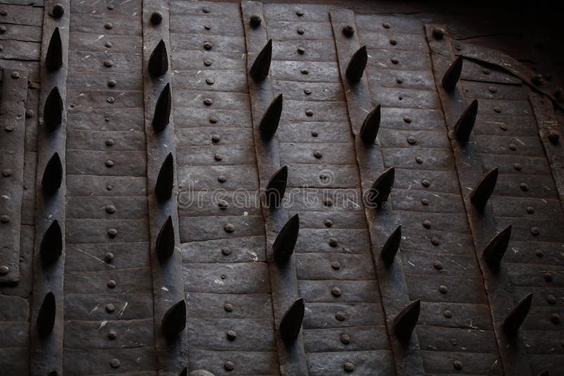 Antique armored gate with sharp spikes. Antique armored gate with sharp spikes.