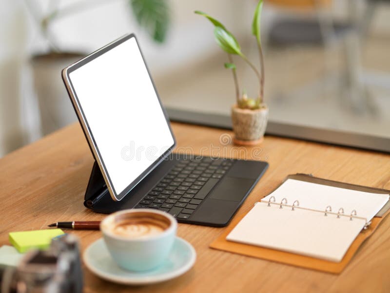 Portable Digital Tablet with Keyboard Stand on Table at Cafe Workspace