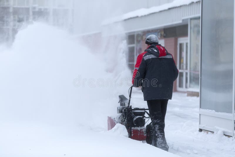 A Portable Snow Blower Powered by Gasoline. Snow Removal in Winter