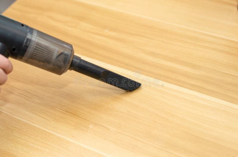 Portable Vacuum Cleaner for Housework Use by Hand on Table Stock Image
