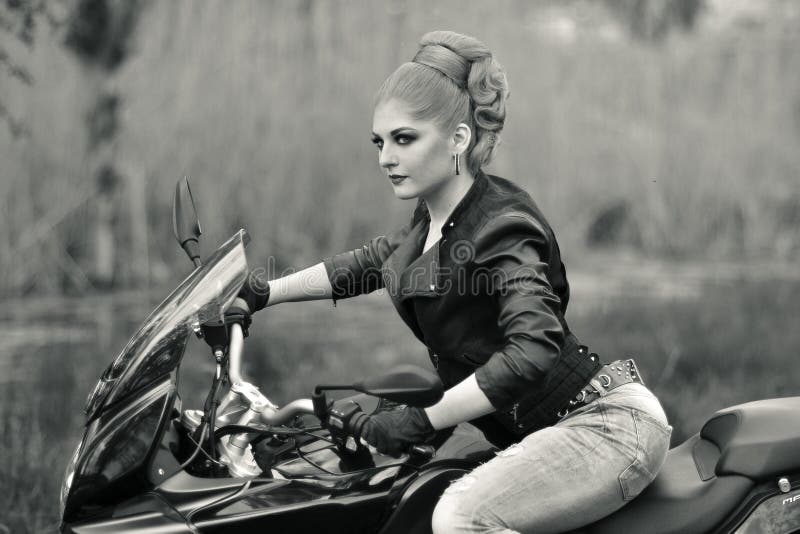 Biker Girl Sits Near The Motorbike Outdoors On The Road Stock Image ...