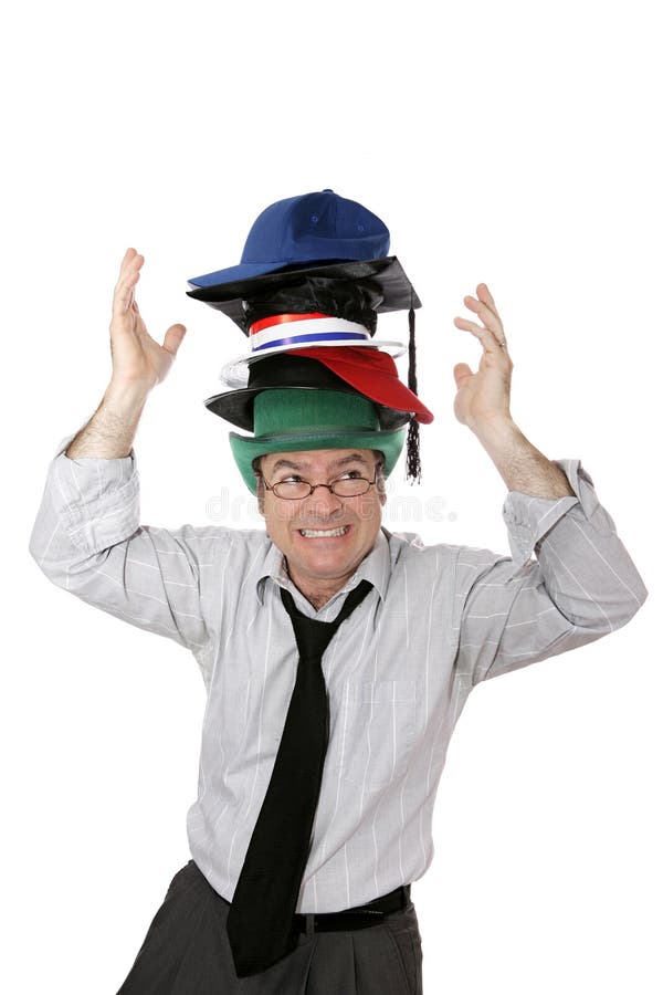 Portare troppi cappelli fotografia stock Portare troppi cappelli fotografia stock