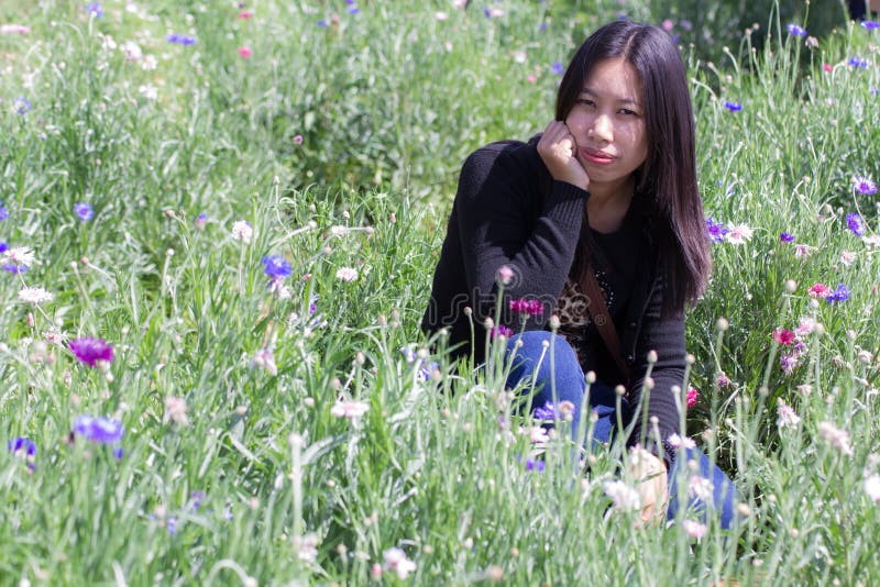 Portarit Thai woman with purple flower garden