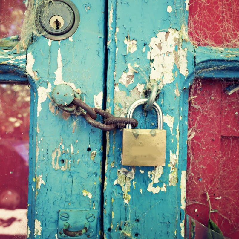 Vintage wood door with metallic lock and chain. Vintage wood door with metallic lock and chain