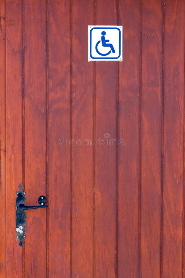 Portello di legno della toletta resa non valida fotografie stock