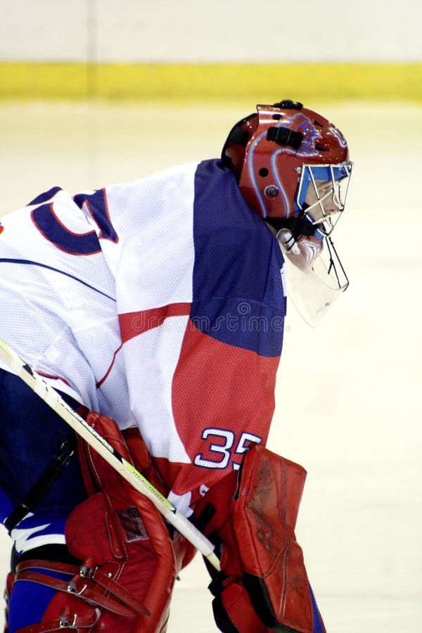 Portiere del hokey di ghiaccio immagine stock Portiere del hokey di ghiaccio immagine stock