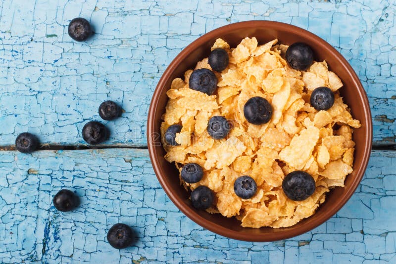 Portion of Corn Flakes with Blueberries and Raspberry Stock Image