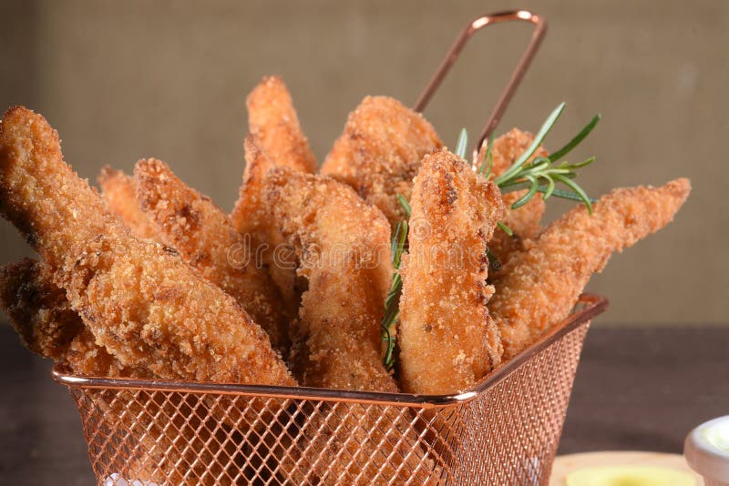 Portion of Fried Fish, Fried Chicken Strips Inside Metal Basket Tasty