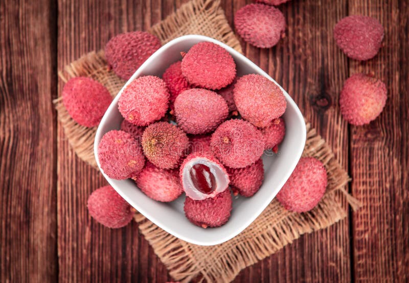 Portion of Lichee Fruits on wooden background selective focus royalty free stock images Portion of Lichee Fruits on wooden background selective focus royalty free stock images