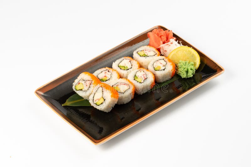 A Portion of Maki Sushi with an Assortment of Japanese Side Dishes in a Rectangular Ceramic
