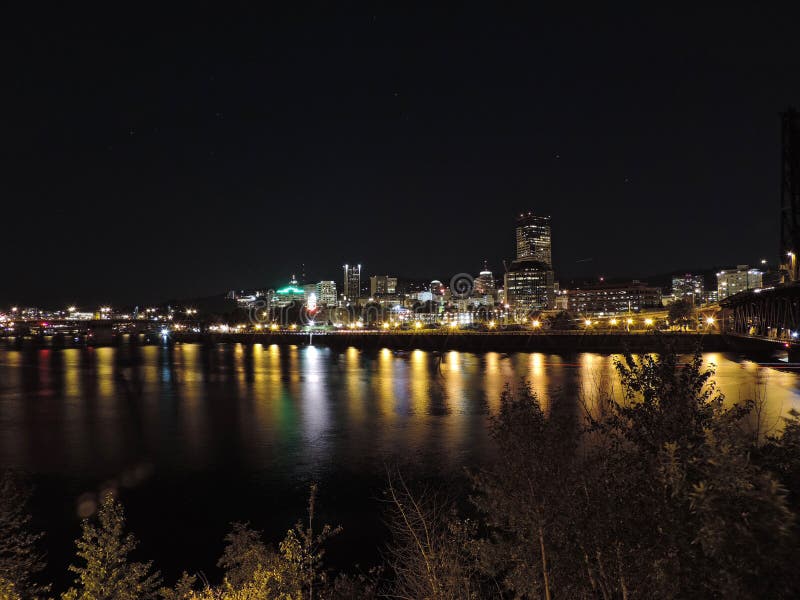 Downtown Portland, Oregon skyline from the Willamette River at night. Koin tower portland oregon stock images, royalty-free photos and pictures