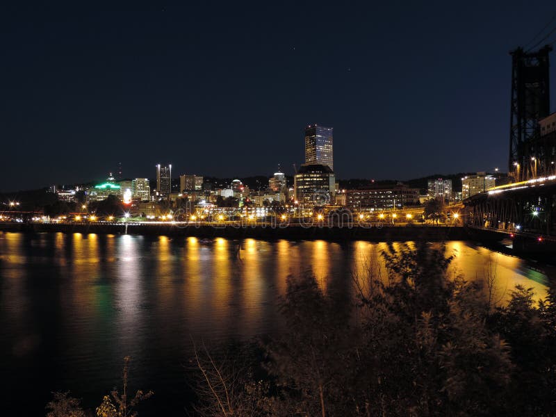 Downtown Portland, Oregon skyline from the Willamette River at night. Koin tower portland oregon stock images, royalty-free photos and pictures