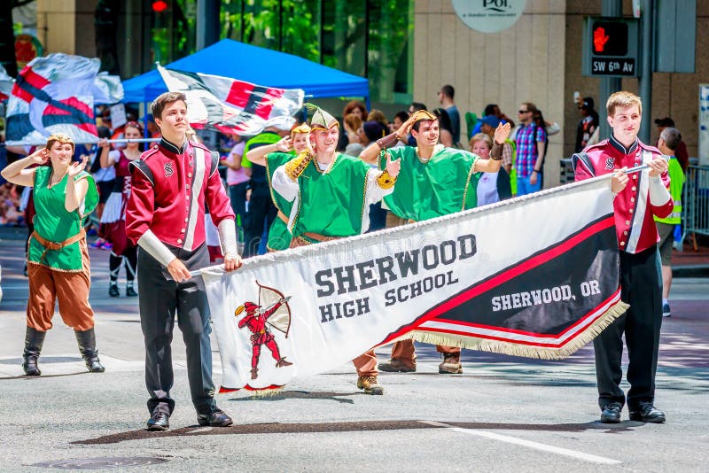 Portland, Oregon, USA - June 6, 2015: Sherwood High School Marching Band in the Grand Floral Parade during Portland Rose Festival 2015. Portland, Oregon, USA - June 6, 2015: Sherwood High School Marching Band in the Grand Floral Parade during Portland Rose Festival 2015.