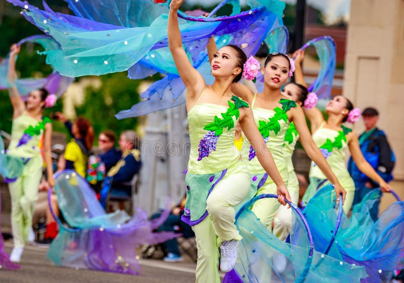 Portland, Oregon, USA - June 11, 2016: Shu-Te Home Economics & Commercial High School Marching Band in the Grand Floral Parade during Portland Rose Festival 2016. Portland, Oregon, USA - June 11, 2016: Shu-Te Home Economics & Commercial High School Marching Band in the Grand Floral Parade during Portland Rose Festival 2016.