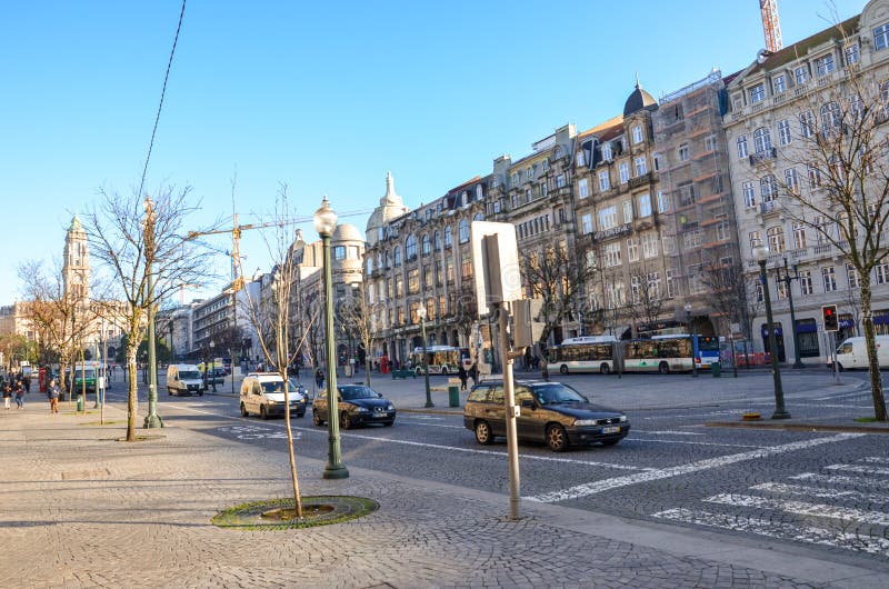 Porto, Portugal - Jan 10, 2020: Street iin the historical old town of the Portuguese city. Road with cars, people on the stock photos Porto, Portugal - Jan 10, 2020: Street iin the historical old town of the Portuguese city. Road with cars, people on the stock photos