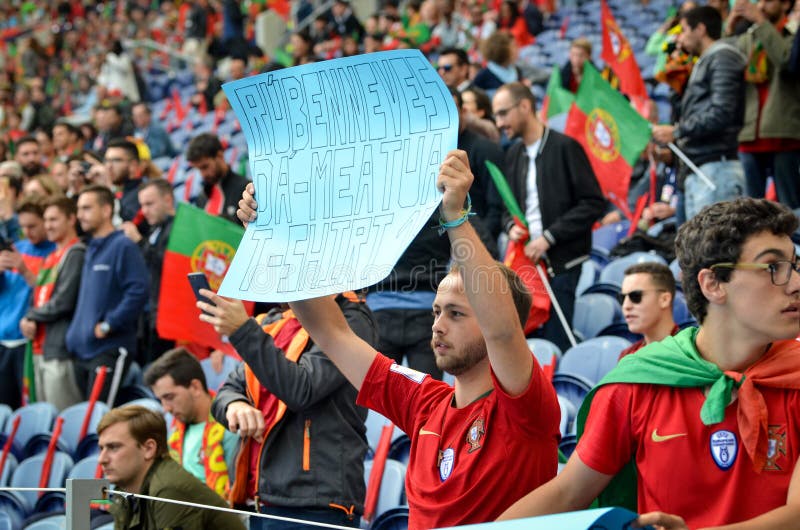 PORTO, PORTUGLAL - June 09, 2019: Fan wants Ruben Neves t-shirt with a poster during the UEFA Nations League semi Finals match between national team Portugal and Switzerland team, Portugal. PORTO, PORTUGLAL - June 09, 2019: Fan wants Ruben Neves t-shirt with a poster during the UEFA Nations League semi Finals match between national team Portugal and Switzerland team, Portugal