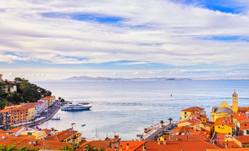 Porto Santo Stefano village, church and seafront panorama. Argentario, Tuscany, Italy