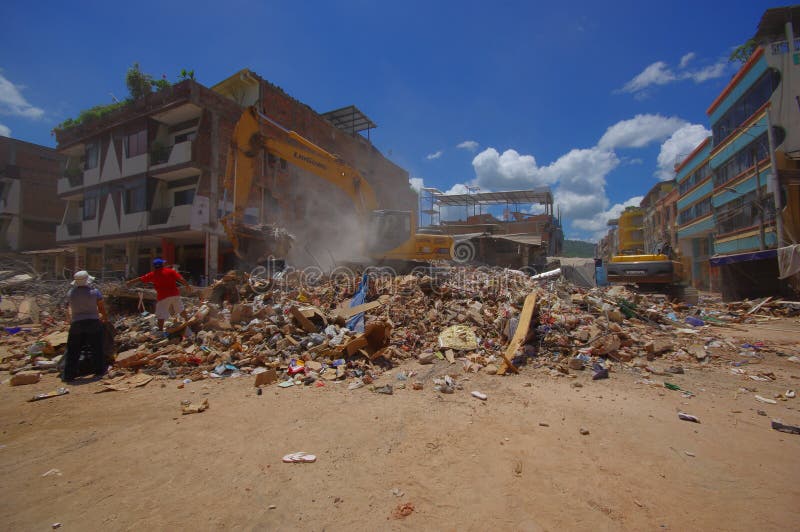 Portoviejo, Ecuador - April, 18, 2016: Building showing the aftereffect of 7. 8 earthquake that destroyed the city center, and most of the Manabi province. with heavy machinery.