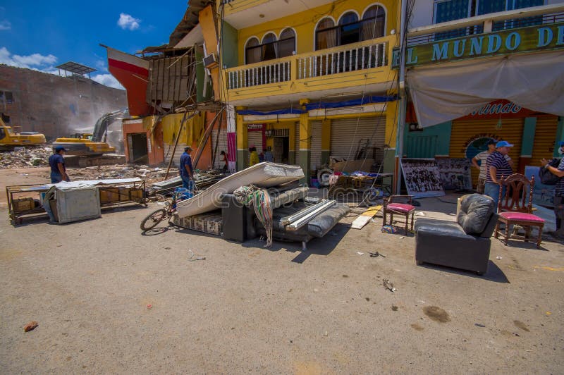 Portoviejo, Ecuador - April, 18, 2016: People gathering their belongings from building showing the aftereffect of 7.8 earthquake that destroyed the city center, and most of the Manabi province. Portoviejo, Ecuador - April, 18, 2016: People gathering their belongings from building showing the aftereffect of 7.8 earthquake that destroyed the city center, and most of the Manabi province.