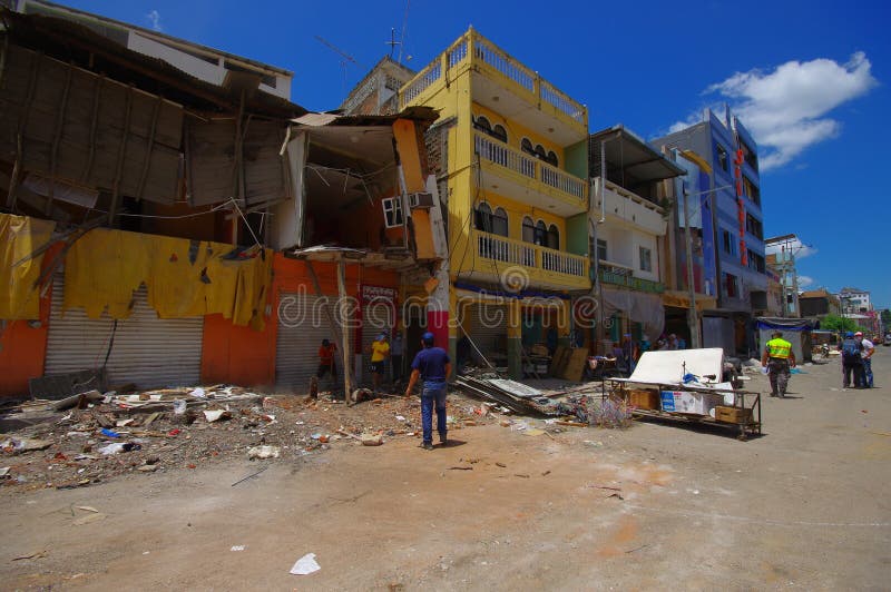 Portoviejo, Ecuador - April, 18, 2016: People gathering their belongings from building showing the aftereffect of 7.8 earthquake that destroyed the city center, and most of the Manabi province. Portoviejo, Ecuador - April, 18, 2016: People gathering their belongings from building showing the aftereffect of 7.8 earthquake that destroyed the city center, and most of the Manabi province.