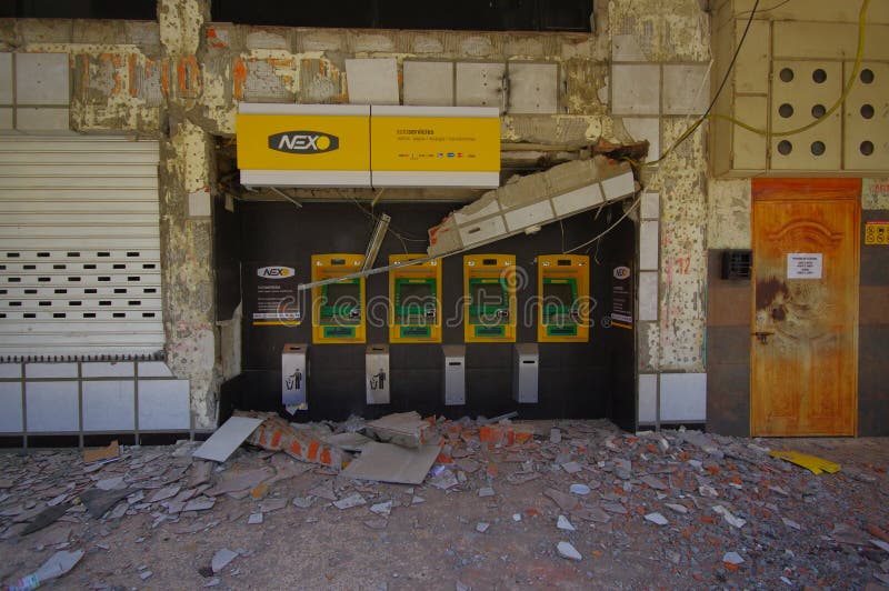 Portoviejo, Ecuador - April, 18, 2016: Pichincha Bank with ATM showing the aftereffect of 7.8 earthquake that destroyed the city center. Portoviejo, Ecuador - April, 18, 2016: Pichincha Bank with ATM showing the aftereffect of 7.8 earthquake that destroyed the city center.