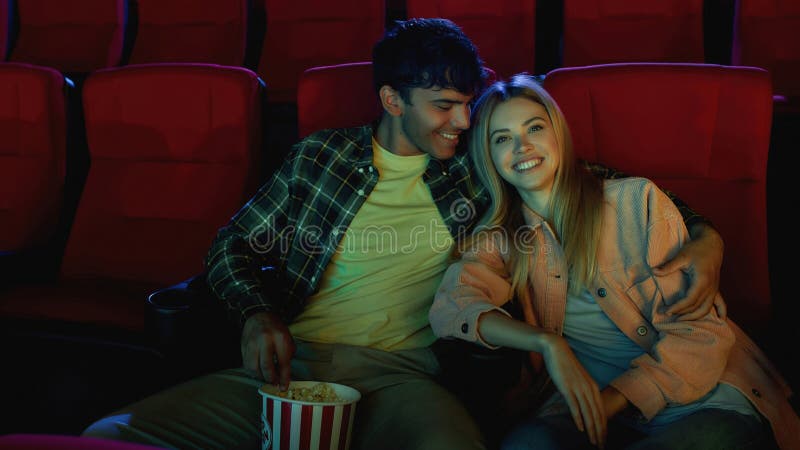 portrait-adorable-couple-happy-young-man-woman-watching-movie-together-having-romantic-date-cinema-portrait-208790125.jpg