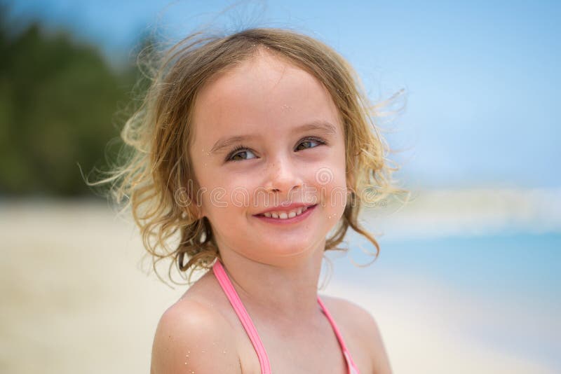 Portrait of adorable little girl at beach during summer vacation Stock  Photo by ©d.travnikov 155048278