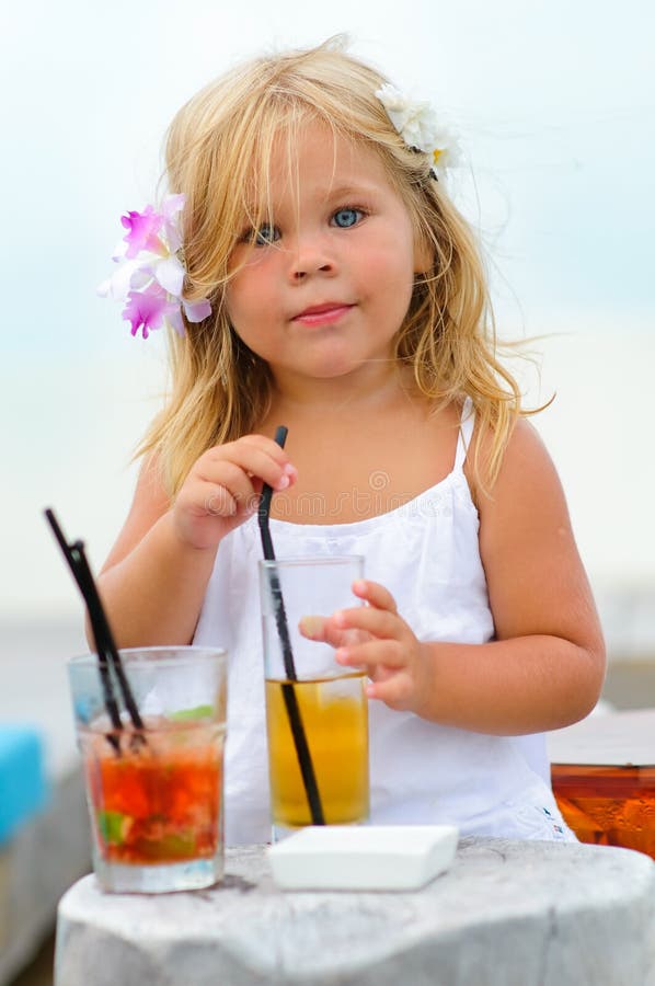 Portrait of adorable little girl with juice stock image Portrait of adorable little girl with juice stock image