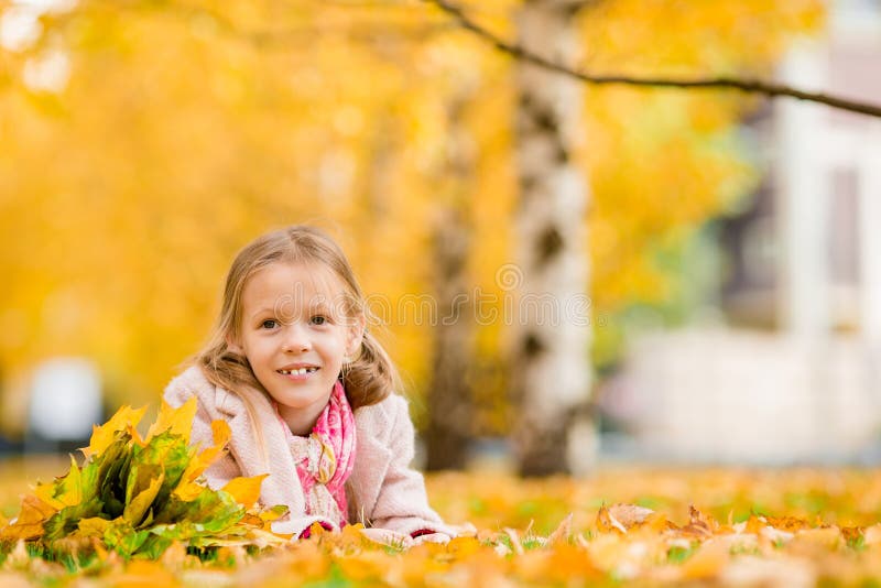 Portrait of Adorable Little Girl with Yellow Leaves Bouquet in Fall ...