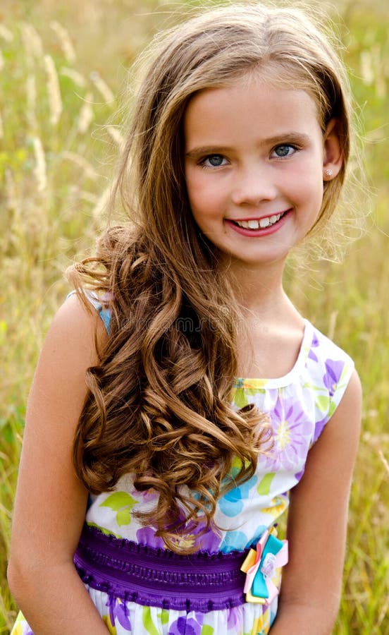 Portrait of Adorable Smiling Little Girl on the Meadow in Summe Stock ...